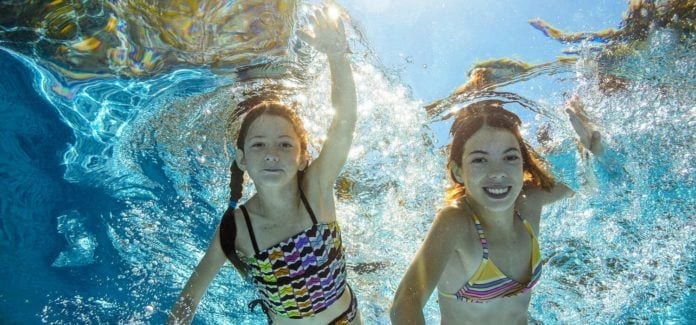 NJ Health-Children swim in pool underwater