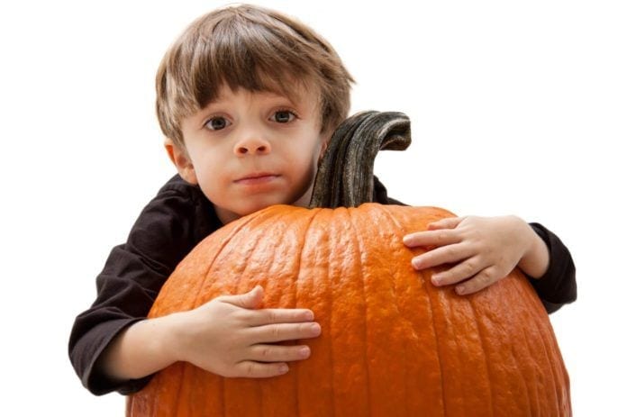 Child Hugging Pumpkin