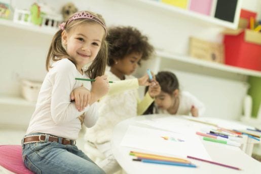 Multiracial children drawing in the playroom