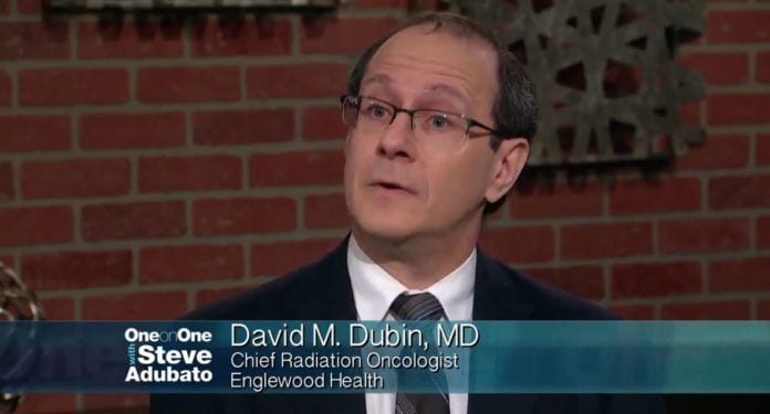 Photo of Dr. David Dubin discussing new cancer screening and cancer treatment technology