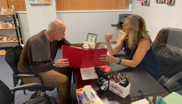 Jerri Meeting with a Client to Discuss Weight Loss Program