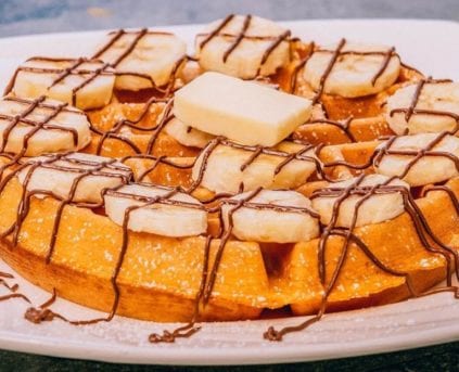 Waffle with Banana Slices and Chocolate Drizzle