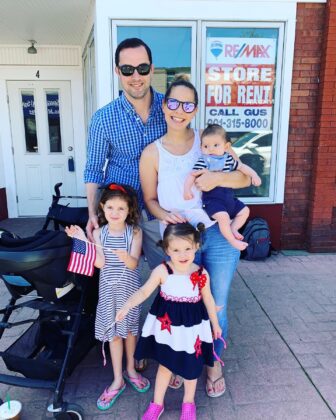 Bridget Zuckerberg and Family outside vacant storefront
