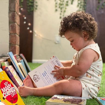Baby Playing with Book