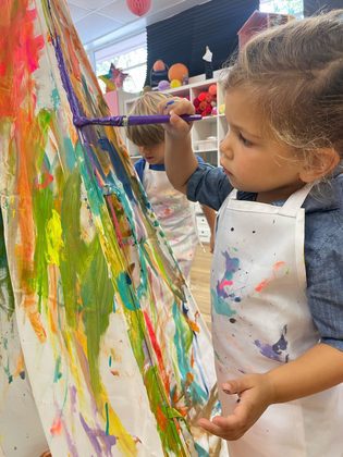 Little Girl Painting on Canvas