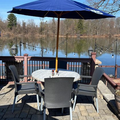 Deck dining at right on the water at Black River Barn.