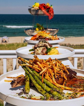 Chef Mike's ABG Outdoor Dining with beach in background.