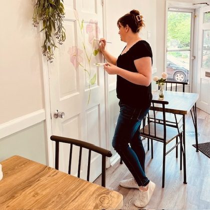Jillian Painting Flower on Door
