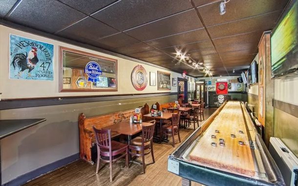 Shuffleboard, Dart board, and TVs inside Old Canal Inn
