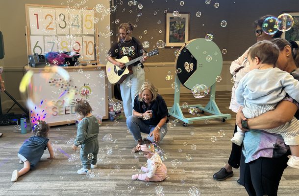 Blowing bubbles during music class
