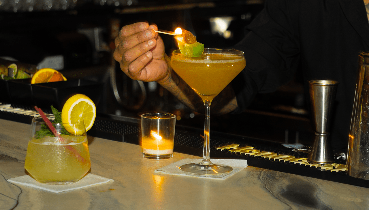 Bartender serving Signature cocktail