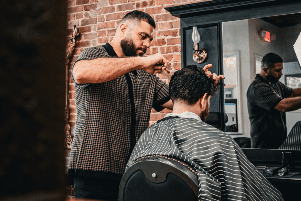 Barber Giving Hair Cut