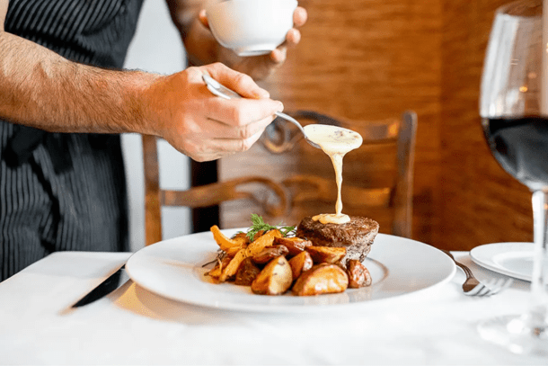 Chef Preparing Meal at Ebbitt Room